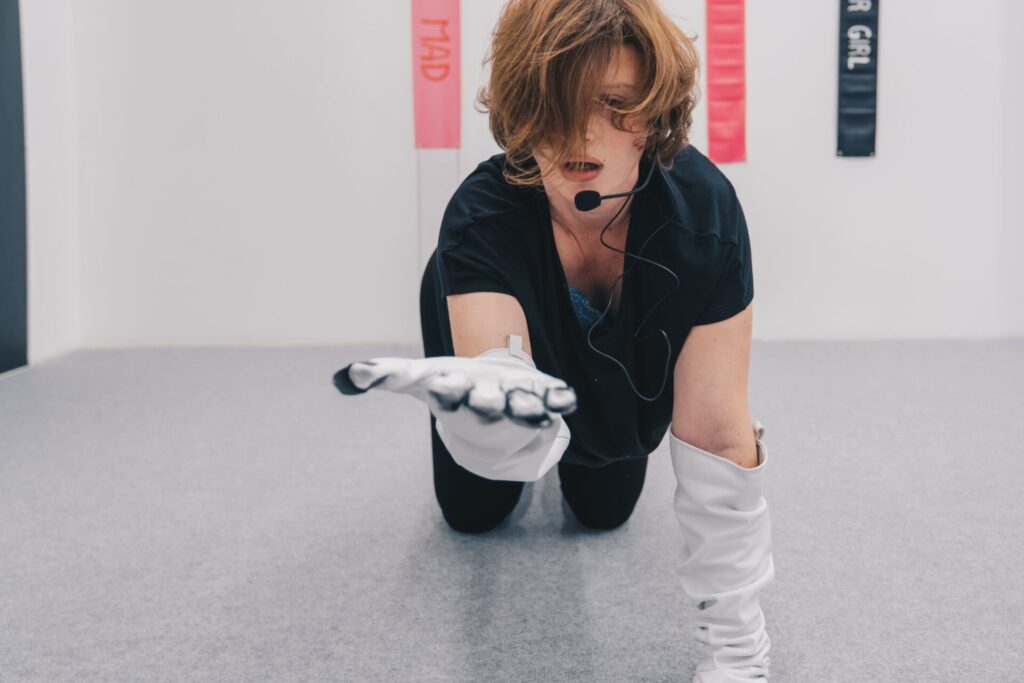 Artist with white gloves and headset