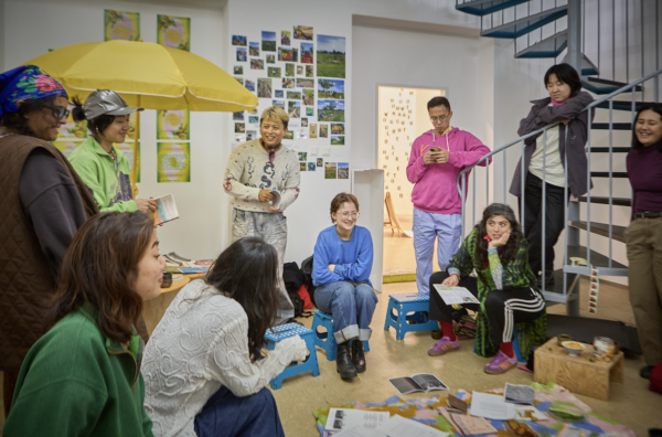 A group of people in a workshop space